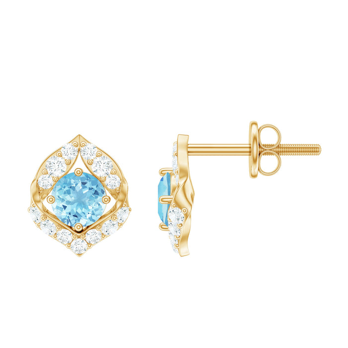 Vintage-inspired aquamarine and diamond leaf earrings by Rosec Jewels featuring intricate leaf design and sparkling gemstones.