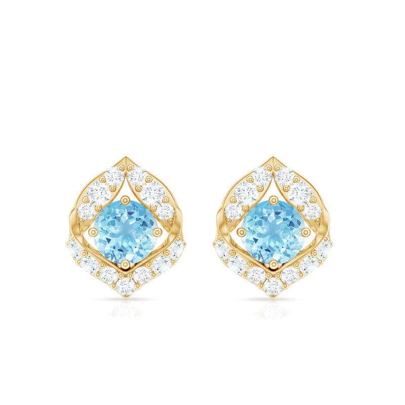 Vintage-inspired aquamarine and diamond leaf earrings by Rosec Jewels featuring intricate metalwork and elegant design.