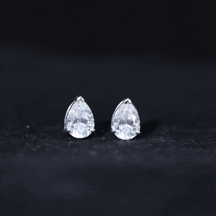 Yellow pear-shaped lab-grown diamond solitaire stud earrings by Rosec Jewels, showcasing elegant diamond jewelry.
