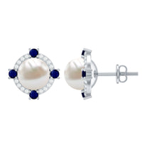 Vintage freshwater pearl earrings with blue sapphire accents, crafted by Rosec Jewels, showcasing elegant jewelry design.