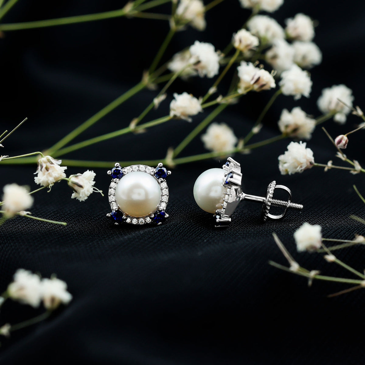 Vintage freshwater pearl earrings with blue sapphire accents from Rosec Jewels, featuring elegant, classic jewelry design.