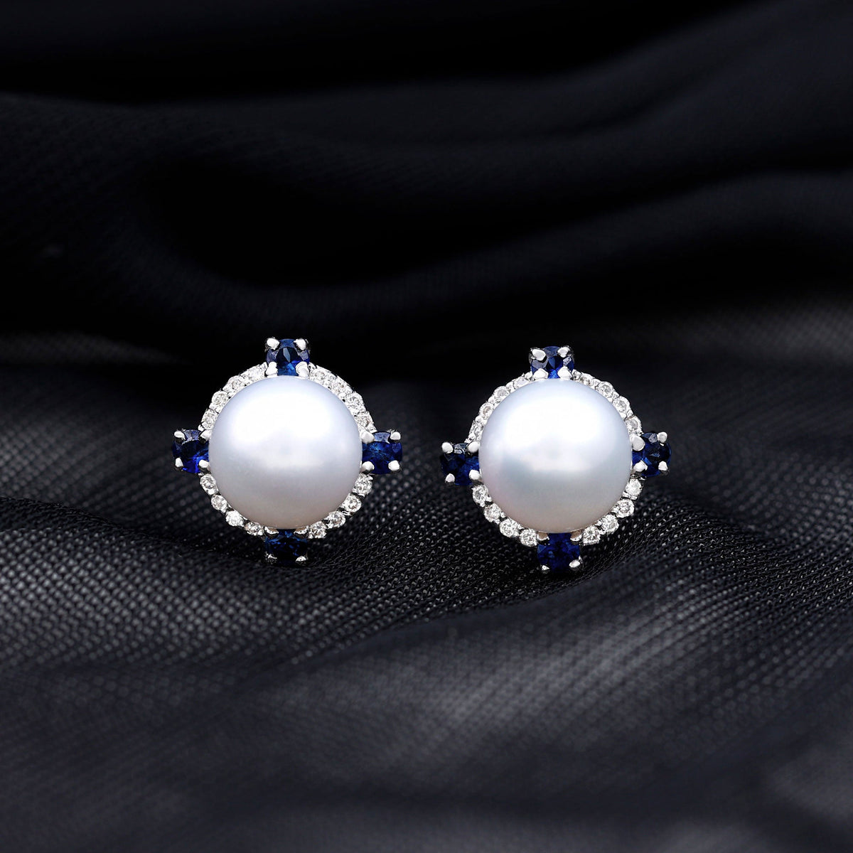 Vintage freshwater pearl earrings with blue sapphire accents from Rosec Jewels, featuring elegant and classic jewelry design.