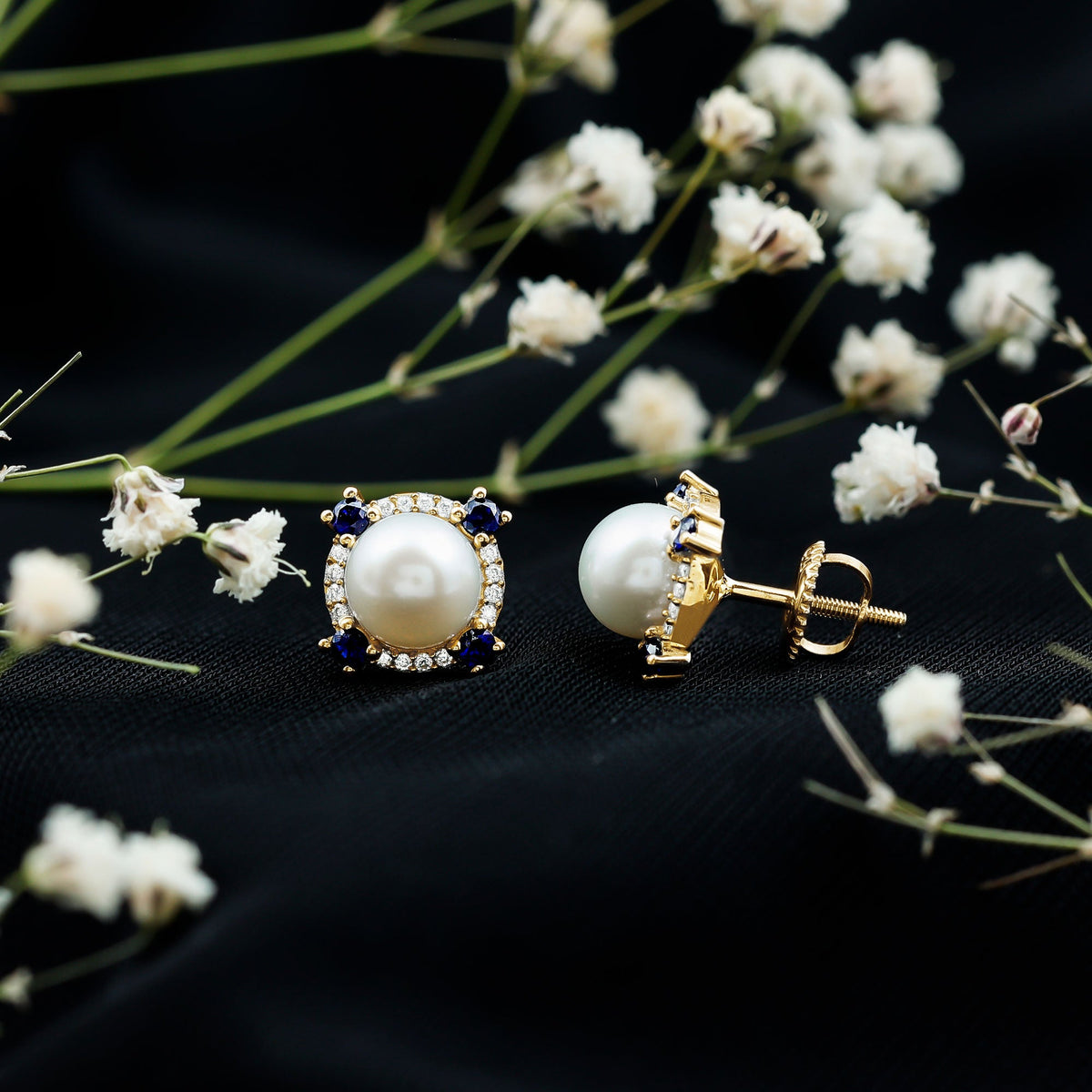 Vintage freshwater pearl earrings with blue sapphire accents, featuring elegant design by Rosec Jewels.