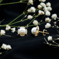 Vintage freshwater pearl earrings with blue sapphire accents, featuring elegant design by Rosec Jewels.