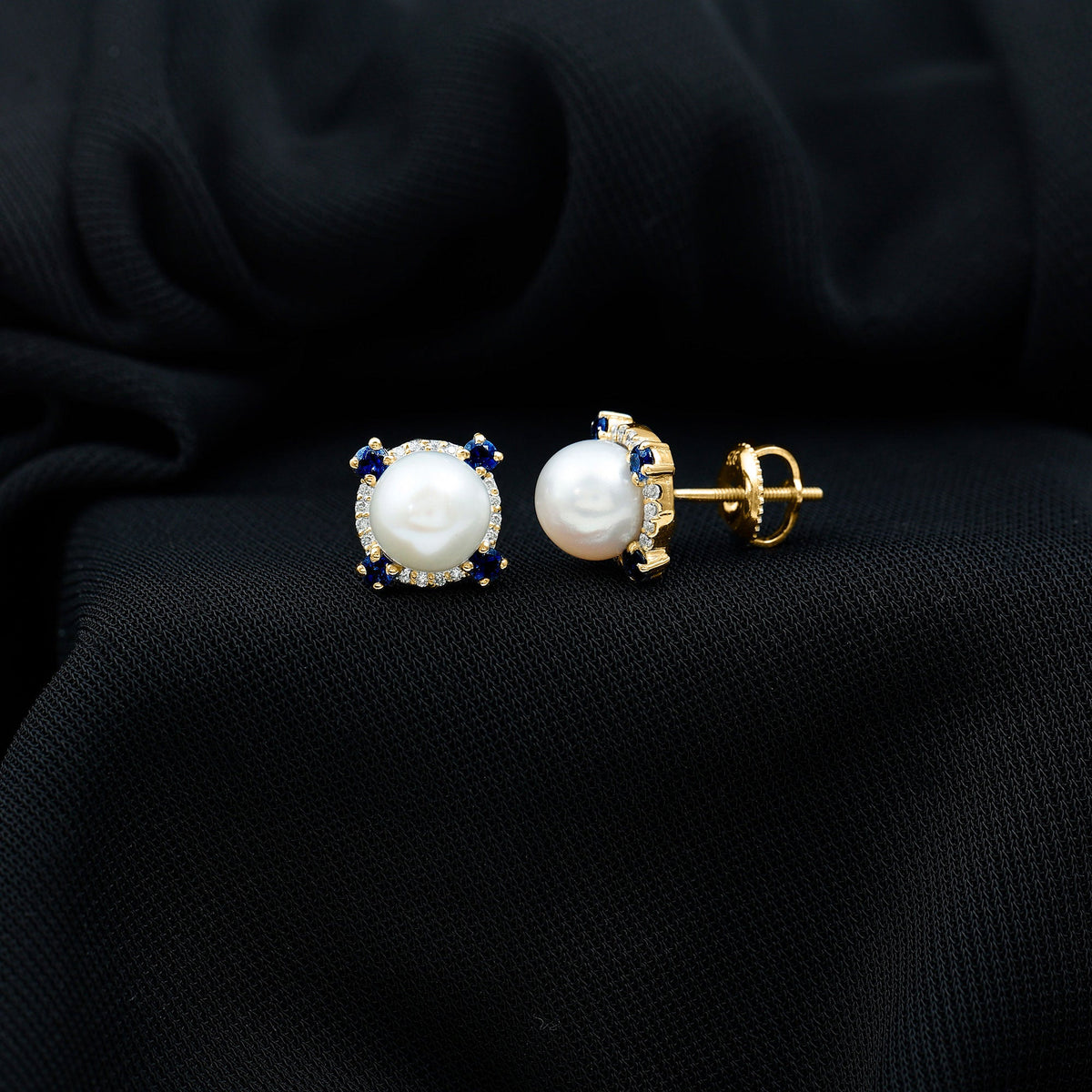 Vintage freshwater pearl earrings with blue sapphire accents from Rosec Jewels, featuring elegant, classic jewelry design.