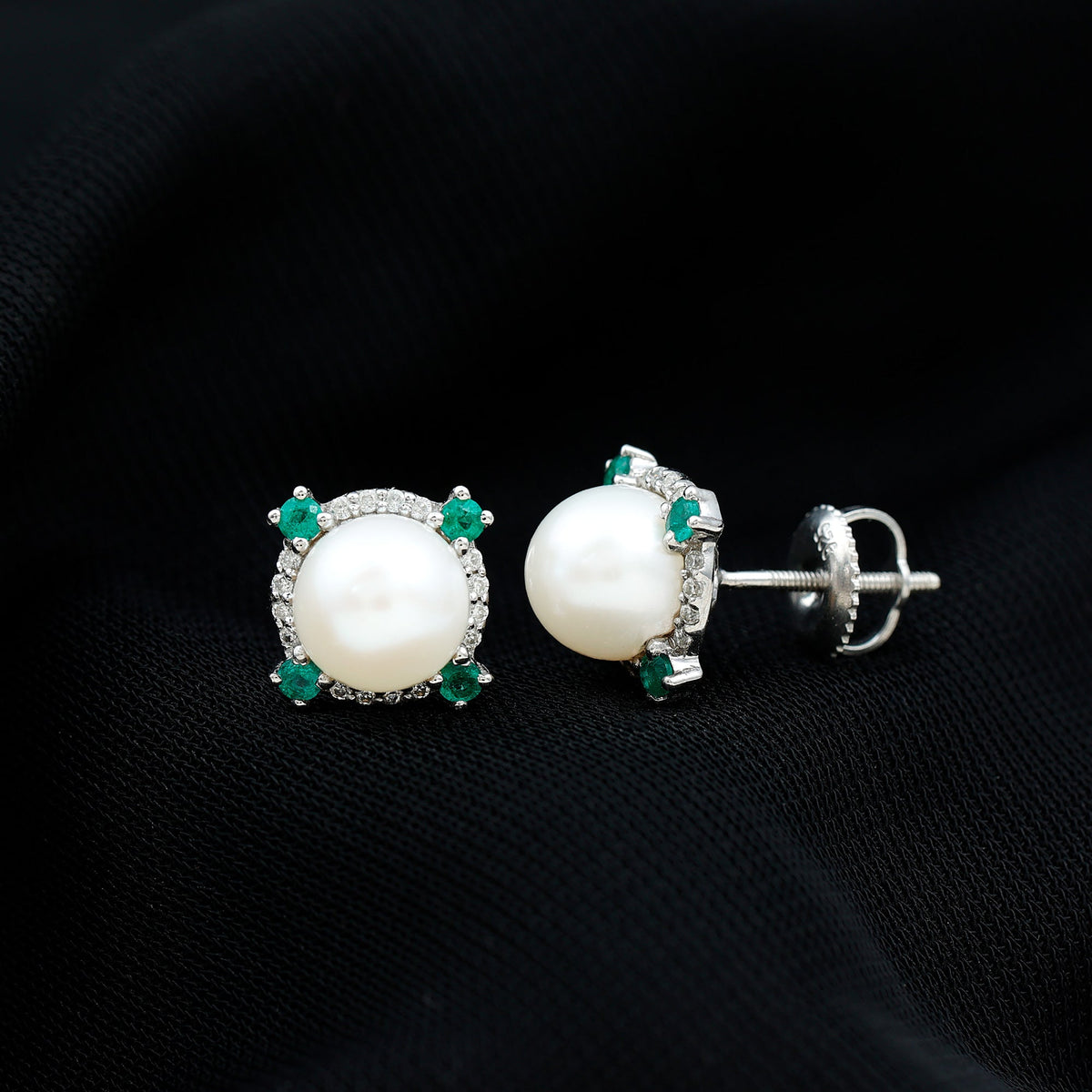 Rosec Jewels freshwater pearl bridal stud earrings with 6-carat emerald accents, featuring elegant pearl and emerald design.
