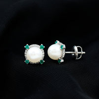 Rosec Jewels freshwater pearl bridal stud earrings with 6-carat emerald accents, featuring elegant pearl and emerald design.