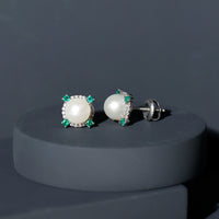 Rosec Jewels 6 Carat freshwater pearl bridal stud earrings with emerald accents, featuring elegant pearl and green gemstone details.