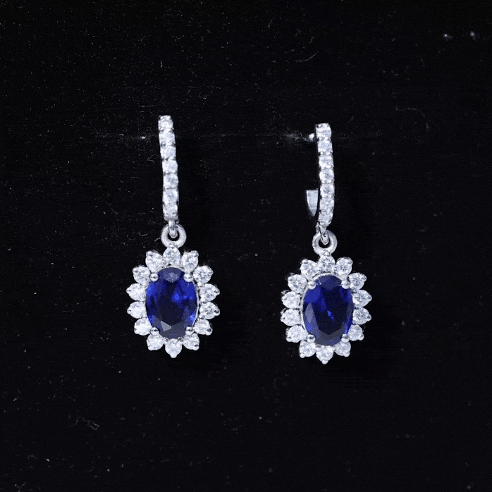 Rosec Jewels women's lab-grown blue sapphire princess Diana-inspired earrings with elegant silver settings.