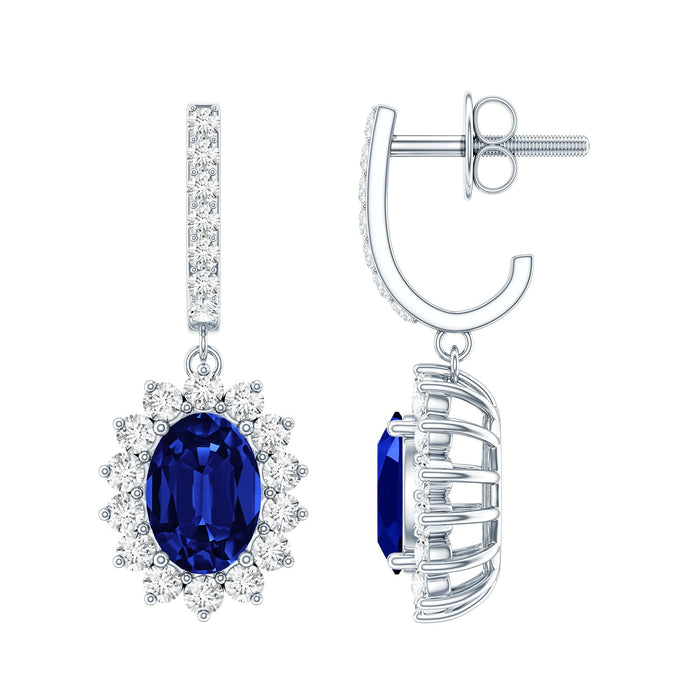 Women's lab-grown blue sapphire earrings inspired by Princess Diana, featuring elegant sterling silver setting and detailed design.