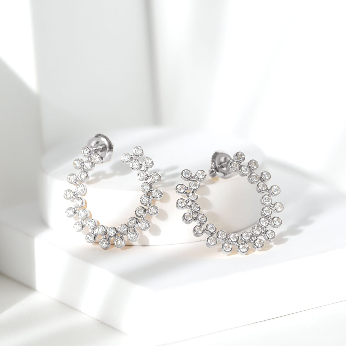 Elegant certified moissanite big stud earrings for women by Rosec Jewels, featuring sparkling gemstone studs on a sleek setting.