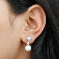 Elegant freshwater pearl and moissanite drop earrings by Rosec Jewels featuring sparkling gemstones and delicate design.