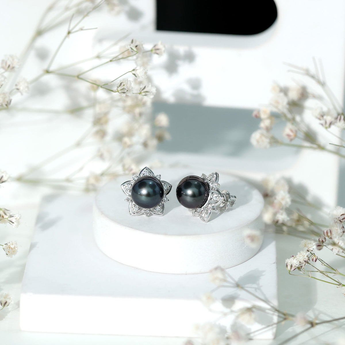 Genuine Tahitian black pearl and diamond flower stud earrings from Rosec Jewels, featuring elegant jewelry design.