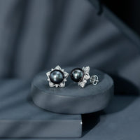 Genuine Tahitian black pearl and diamond flower stud earrings by Rosec Jewels featuring elegant black pearls and sparkling diamonds
