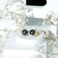 Genuine Tahitian black pearl and diamond flower stud earrings by Rosec Jewels featuring elegant black pearls and sparkling diamonds.