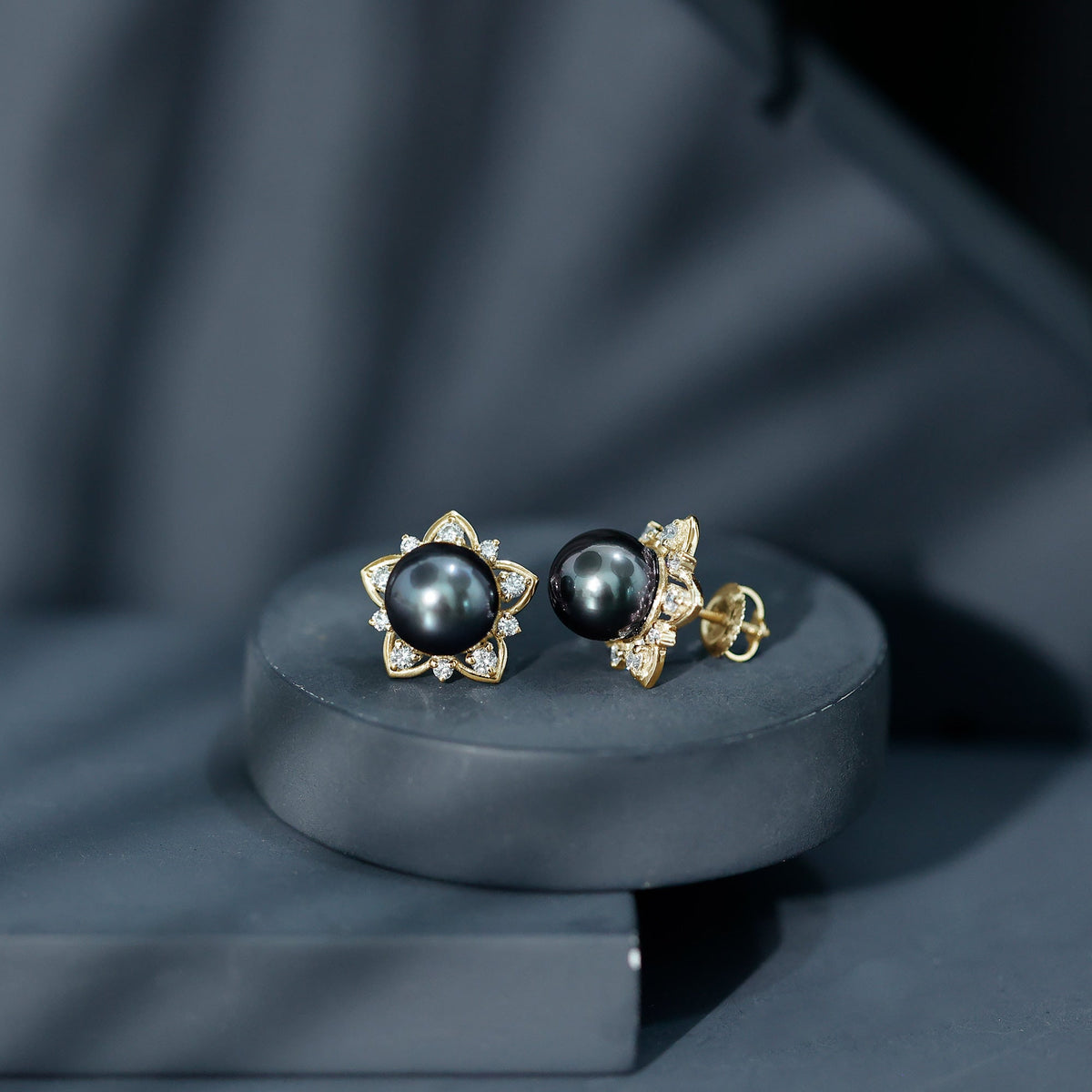 Genuine Tahitian black pearl and diamond flower stud earrings by Rosec Jewels featuring elegant pearl and sparkling diamonds.