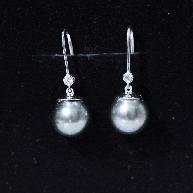 Tahitian black pearl dangling earrings with diamonds by Rosec Jewels, featuring elegant gold hooks and lustrous pearls.