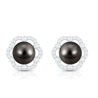 Tahitian black pearl and diamond flower stud earrings by Rosec Jewels featuring 15-carat pearls and sparkling diamonds.
