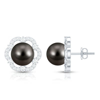 Tahitian black pearl and diamond flower stud earrings by Rosec Jewels featuring 15-carat black pearls and sparkling diamonds.
