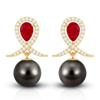 Vintage style Tahitian black pearl bridal earrings with ruby accents, crafted by Rosec Jewels.