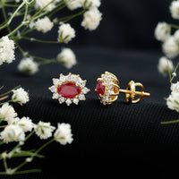 Oval cut ruby and diamond halo stud earrings by Rosec Jewels featuring genuine gemstones and elegant design.
