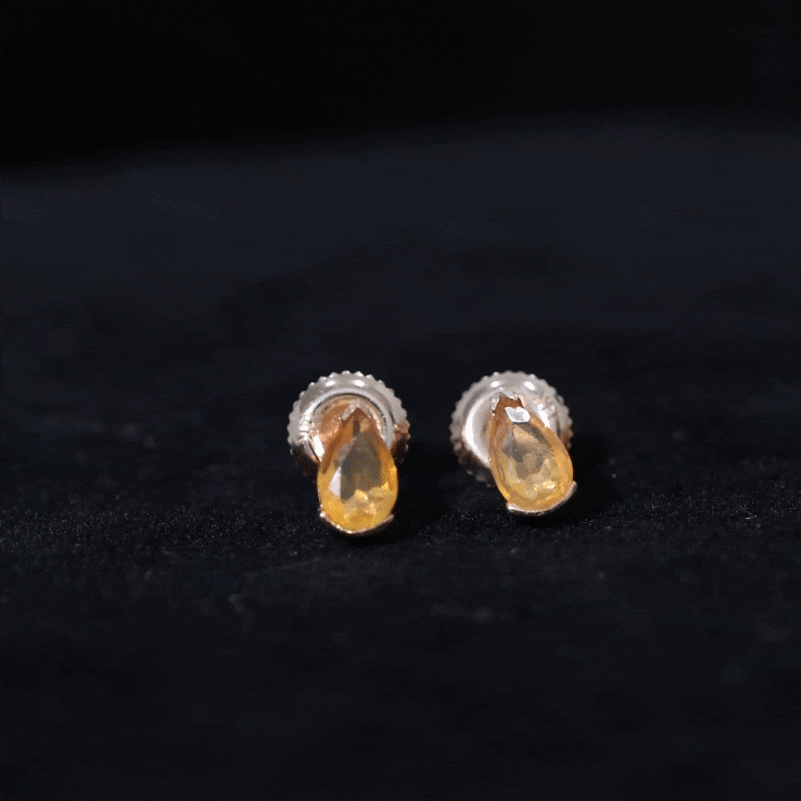 Natural 1 Carat Yellow Fire Opal teardrop stud earrings by Rosec Jewels featuring vibrant, teardrop-shaped fire opals on silver studs.