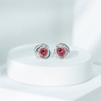 Pink tourmaline swirl stud earrings featuring 0.9 carats from Rosec Jewels, showcasing elegant jewelry design and sterling silver posts.