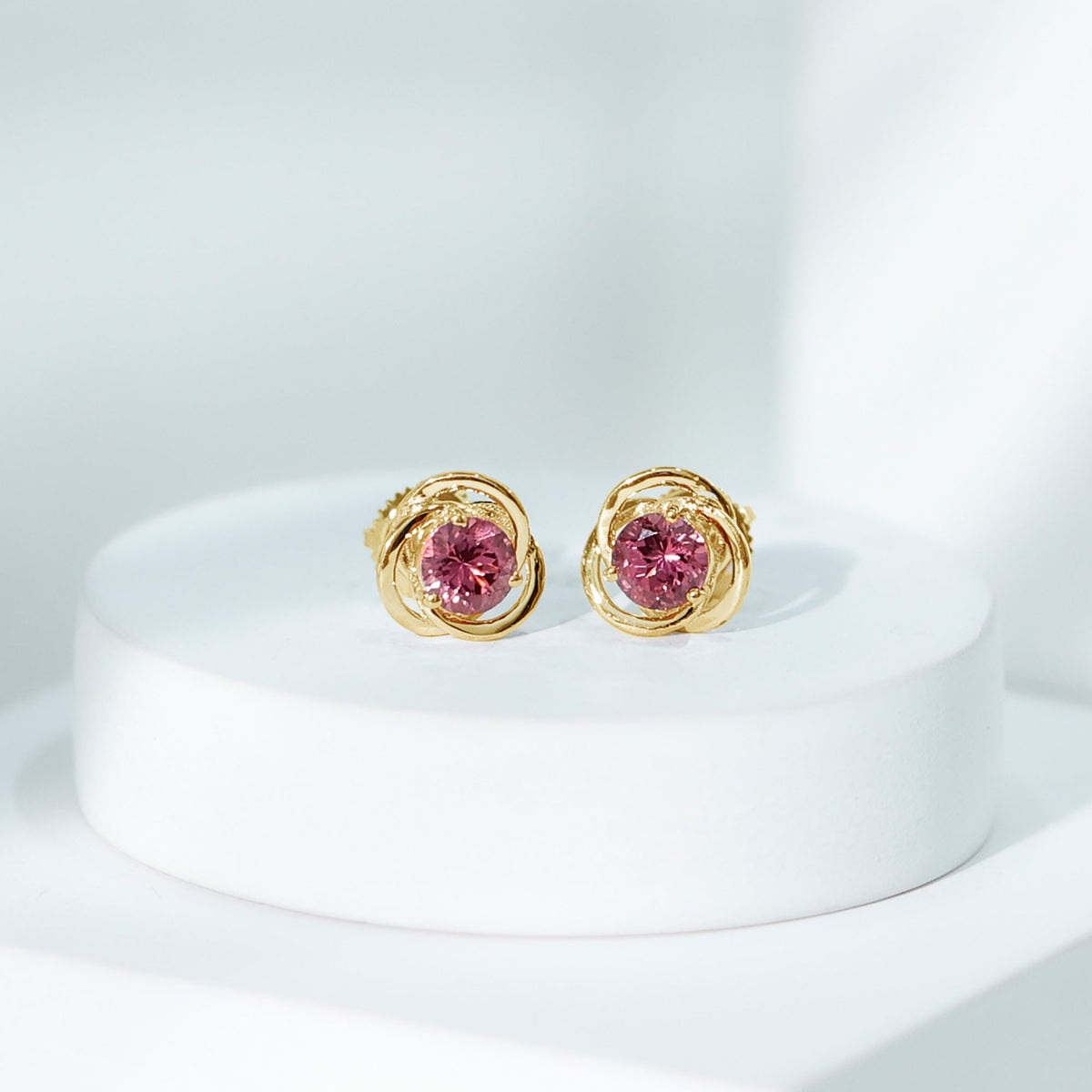 Pink tourmaline swirl stud earrings by Rosec Jewels featuring 0.9 carat solitaire gemstones in a delicate design.