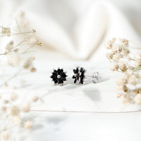 Marquise shape black onyx floral statement stud earrings by Rosec Jewels with intricate floral design and polished black onyx stones.