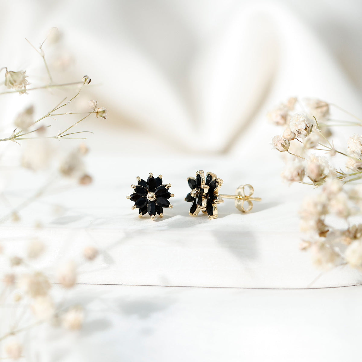 Marquise-shaped black onyx floral statement stud earrings by Rosec Jewels featuring elegant gemstone design.