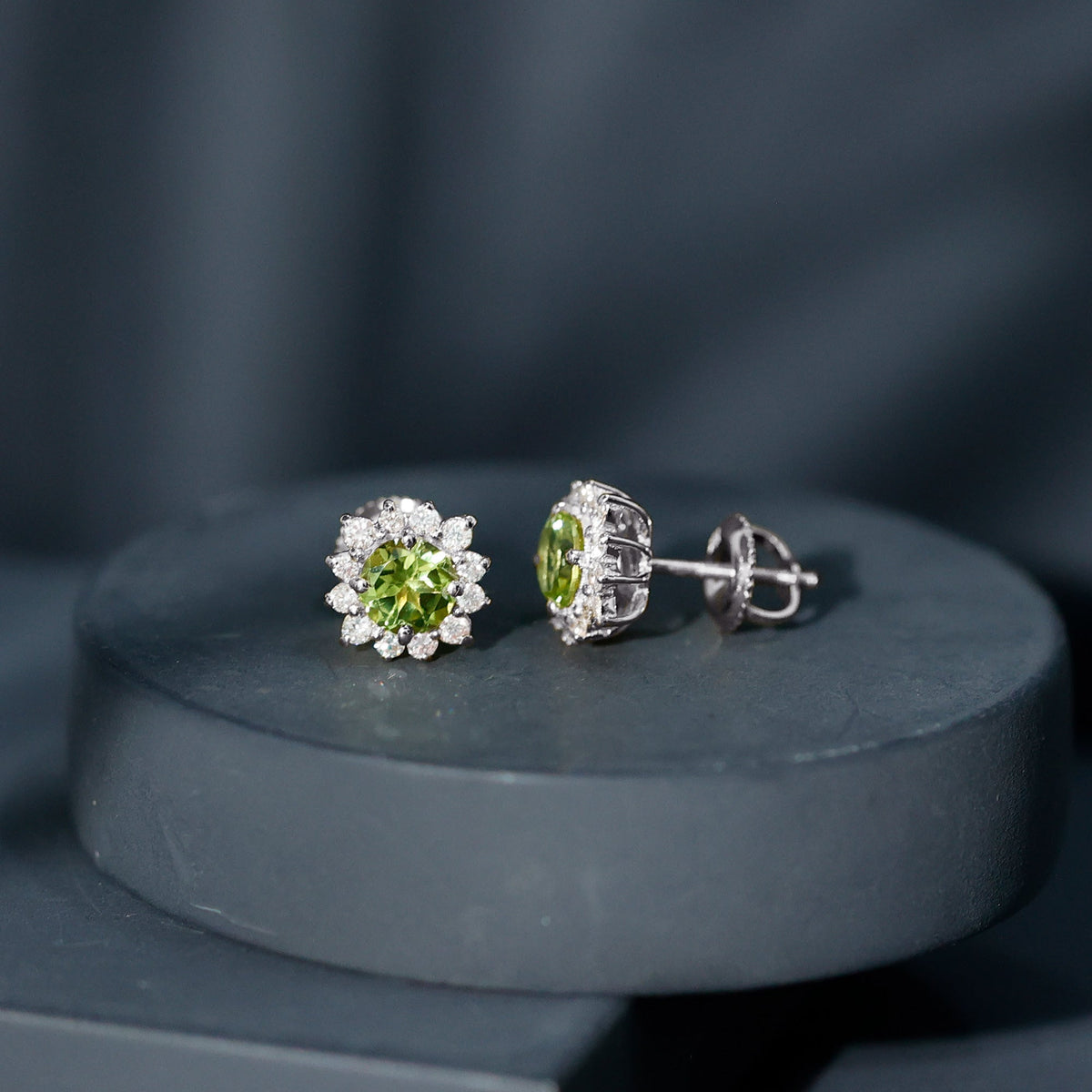 Rosec Jewels 1 Carat Peridot stud earrings with diamond halo, showcasing vibrant green peridot gemstones and sparkling diamond accents.