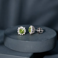 Rosec Jewels 1 Carat Peridot stud earrings with diamond halo, showcasing vibrant green peridot gemstones and sparkling diamond accents.