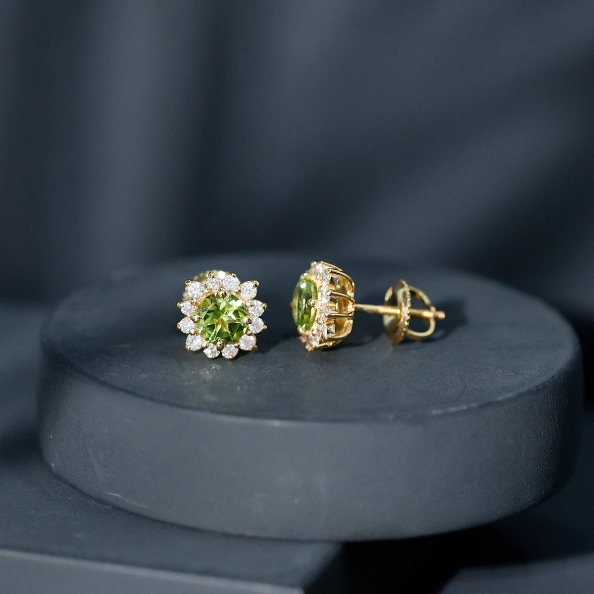 Rosec Jewels 1 Carat Peridot stud earrings with diamond halo, featuring vibrant green peridot gemstones and sparkling diamond accents.