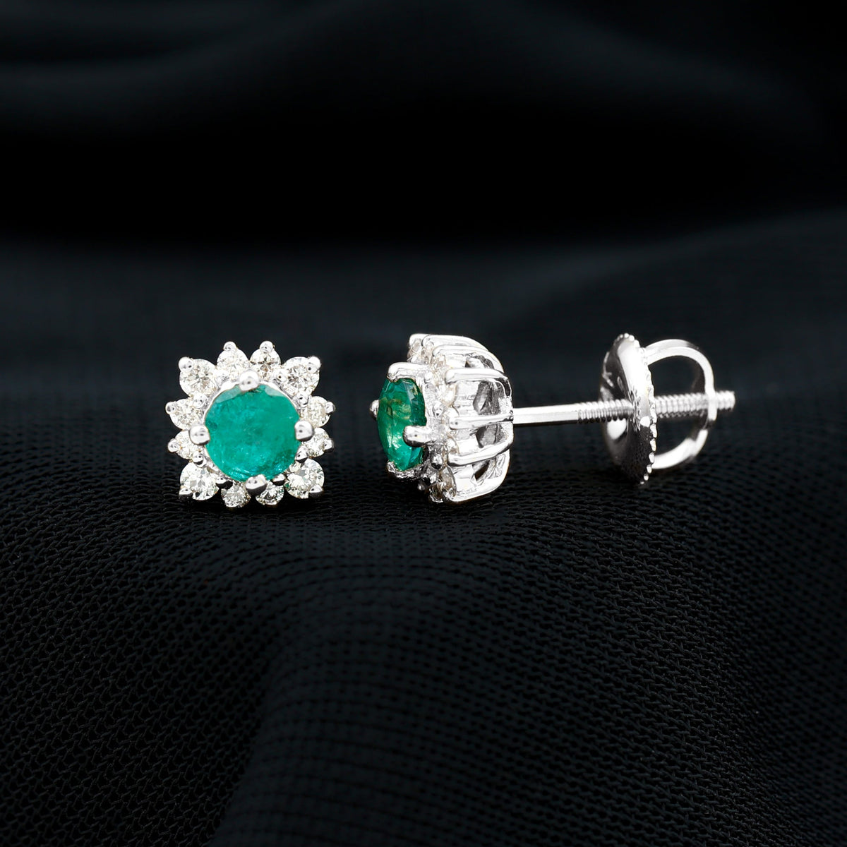 Real emerald stud earrings with diamond halo featuring vibrant green emeralds and sparkling diamonds in Rosec Jewels design.