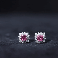 Round pink tourmaline stud earrings with diamond halo, showcasing elegant jewelry design by Rosec Jewels.