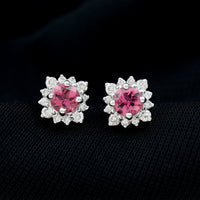 Round pink tourmaline stud earrings with diamond halo by Rosec Jewels, showcasing sparkling pink gemstones and elegant design.