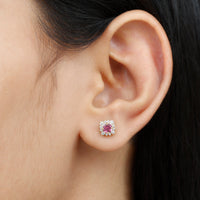 Round pink tourmaline stud earrings with diamond halo from Rosec Jewels, featuring sparkling pink gemstones and a elegant design.