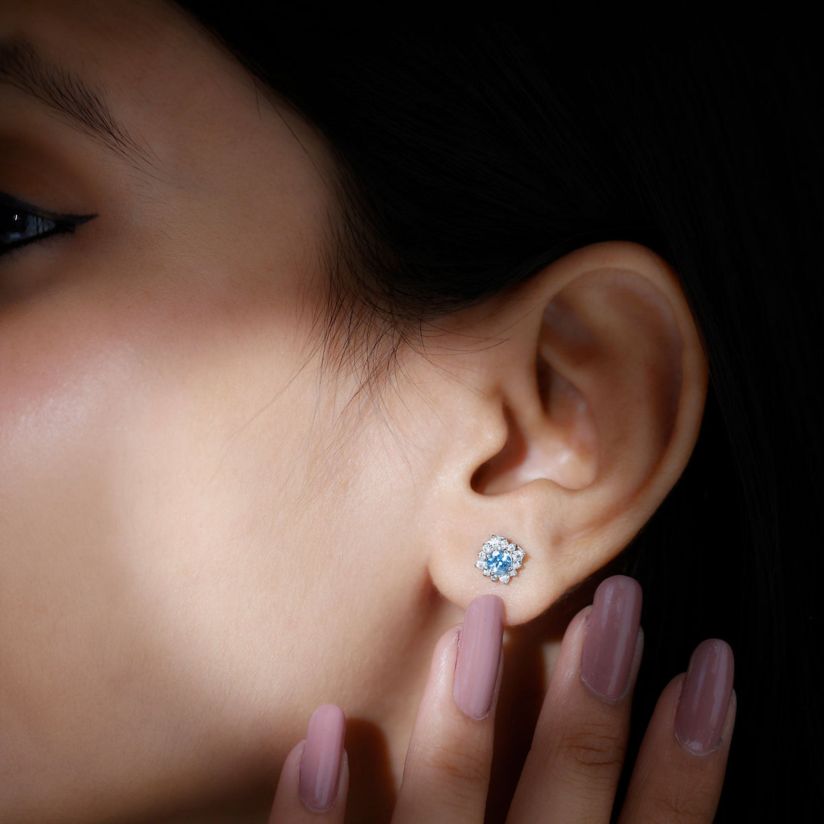 Real aquamarine stud earrings with diamond halo by Rosec Jewels, featuring vibrant blue aquamarine stones and sparkling diamond accents.
