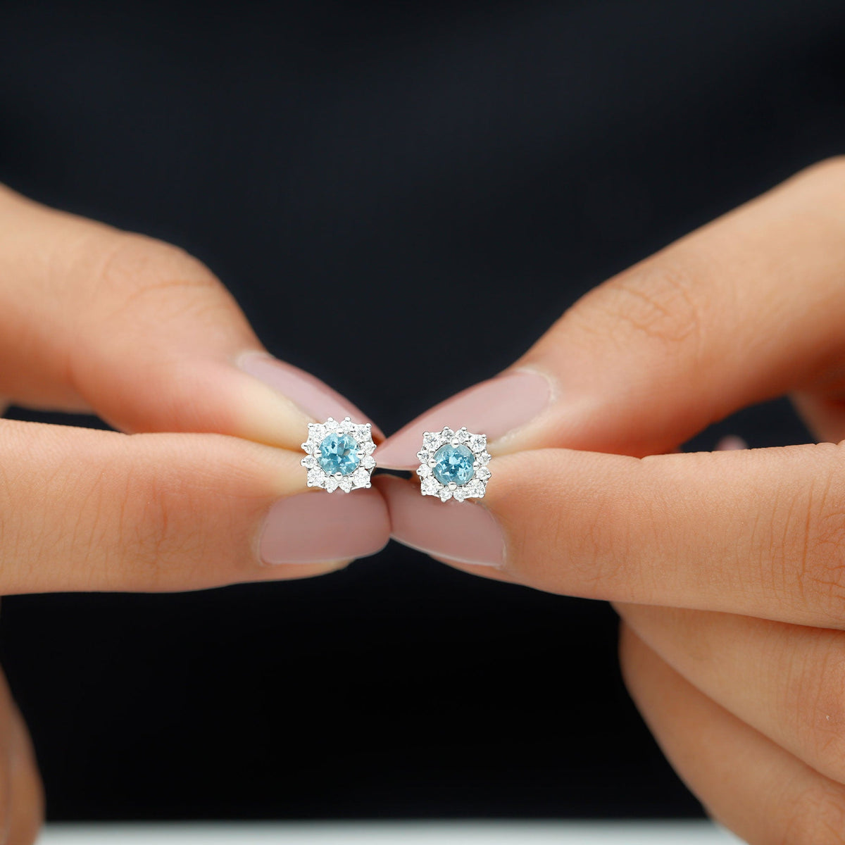Real aquamarine stud earrings with diamond halo from Rosec Jewels featuring sparkling gemstones and elegant jewelry design.