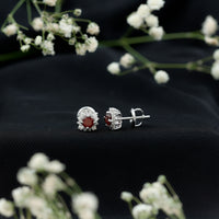 Rosec Jewels 0.6 Carat garnet stud earrings with diamond halo, showcasing classic jewelry design and sparkling gemstone accents.