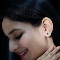 0.6 carat garnet stud earrings with diamond halo from Rosec Jewels, showcasing elegant red gemstone and sparkling diamond accents.
