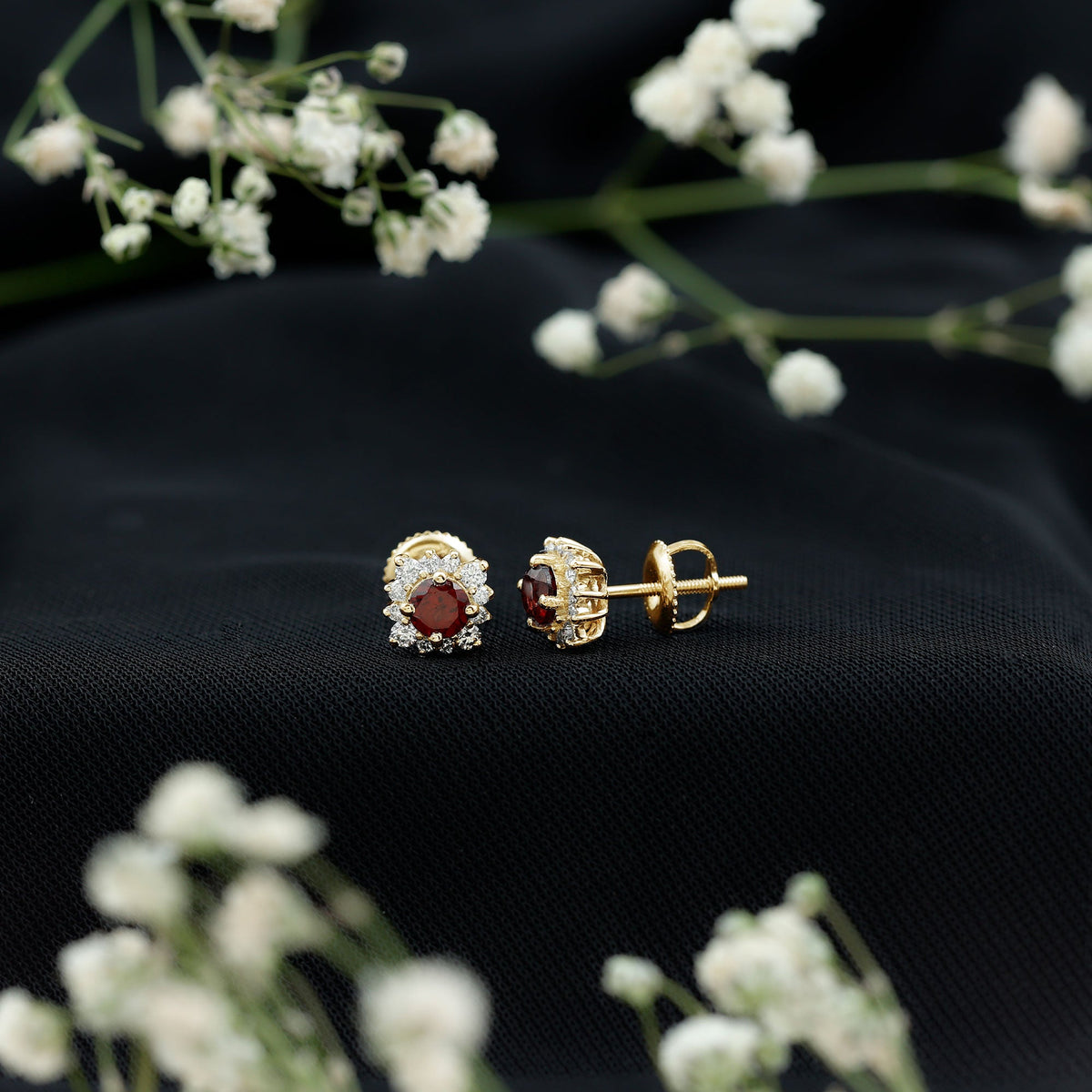 Rosec Jewels 0.6 Carat Garnet stud earrings with diamond halo, showcasing elegant red garnet gemstones and sparkling diamond accents.
