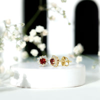 0.6 carat garnet stud earrings with diamond halo from Rosec Jewels, showcasing elegant red gemstone and sparkling diamond accents.