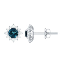 Rosec Jewels 1.25 CT London Blue Topaz stud earrings with diamond halo, featuring vibrant blue gemstones and sparkling accents