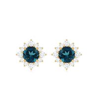 Rosec Jewels 1.25 CT London Blue Topaz stud earrings with diamond halo, showcasing elegant blue gemstones and sparkling accents.