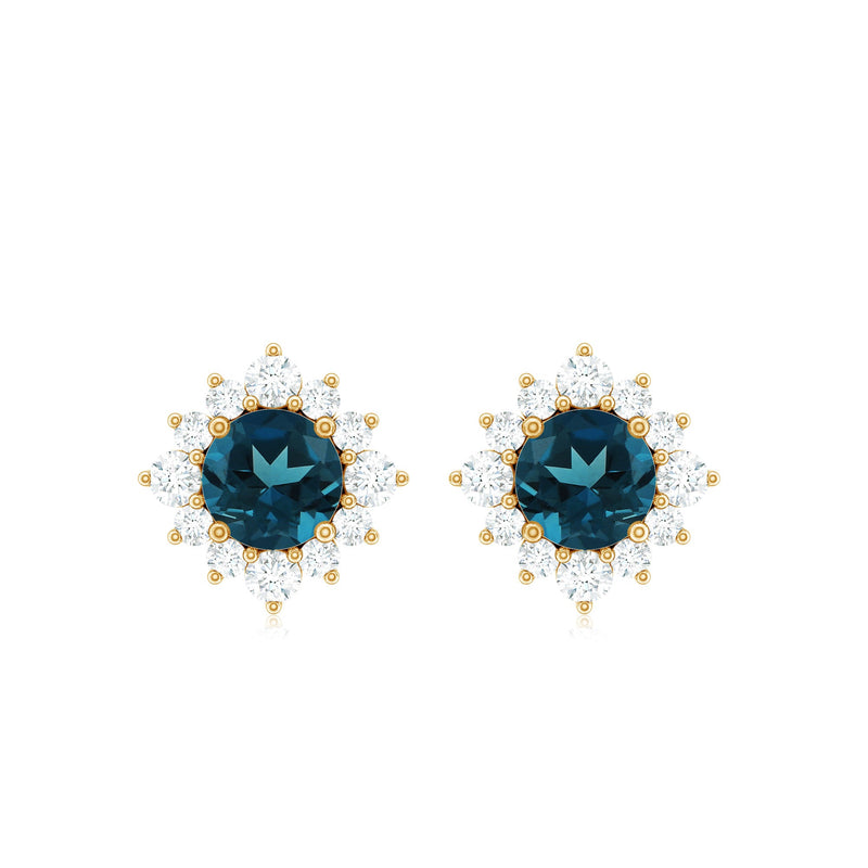 Rosec Jewels 1.25 CT London Blue Topaz stud earrings with diamond halo, showcasing elegant blue gemstones and sparkling accents.