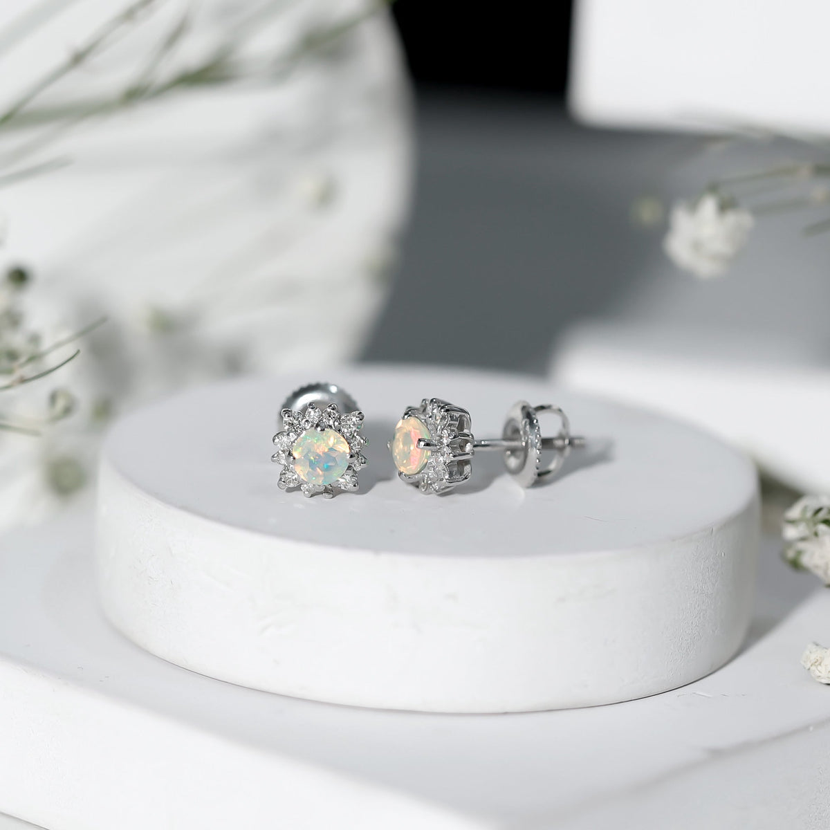Classic Ethiopian Opal stud earrings with diamond halo from Rosec Jewels, featuring vibrant opals and sparkling diamond accents.