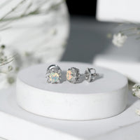 Classic Ethiopian Opal stud earrings with diamond halo from Rosec Jewels, featuring vibrant opals and sparkling diamond accents.