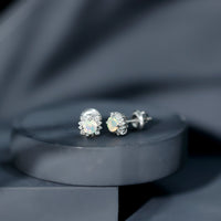 Ethiopian opal stud earrings with diamond halo, Rosec Jewels, featuring vibrant opal stones and sparkling diamond accents.