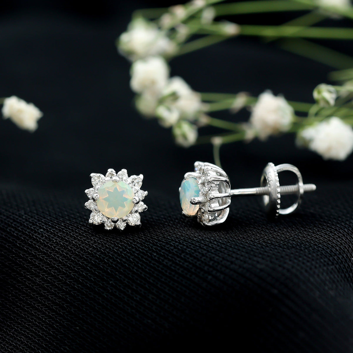 Classic Ethiopian Opal stud earrings with diamond halo from Rosec Jewels, featuring vibrant opal gemstones and sparkling diamond accents.